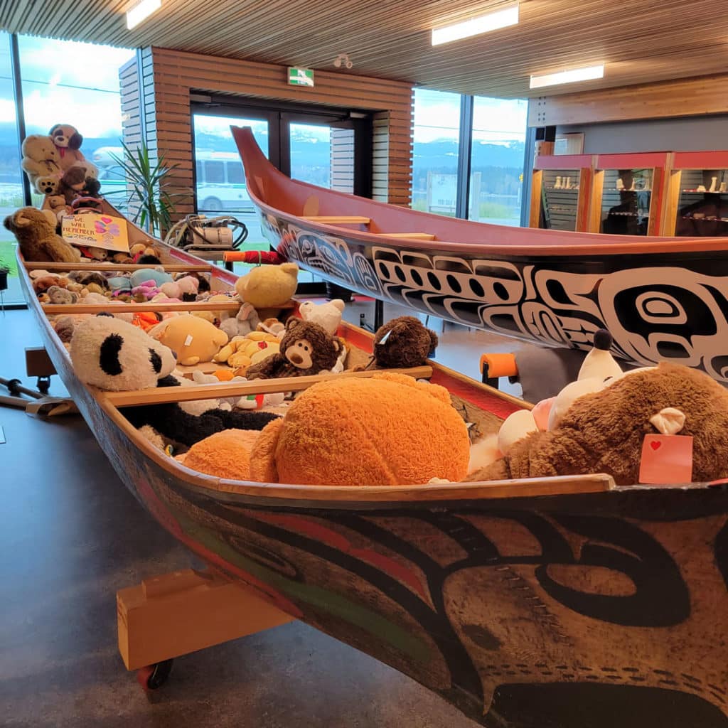 Long boats with stuffed animals in K’ómoks First Nation